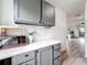 View of the kitchen with appliances, countertops, and connection to the living space at 147 114Th Ne Ave # 147, St Petersburg, FL 33716