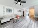 Spacious living room with a ceiling fan and wood flooring at 147 114Th Ne Ave # 147, St Petersburg, FL 33716