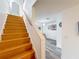 Beautiful wooden staircase leading to a bright, open living area at 147 114Th Ne Ave # 147, St Petersburg, FL 33716