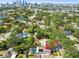 This aerial view shows a residential neighborhood with mature trees and a home with a pool at 150 Bosphorous Ave, Tampa, FL 33606