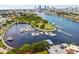 Picturesque aerial view of a marina showcasing a variety of boats with the city skyline in the background at 150 Bosphorous Ave, Tampa, FL 33606