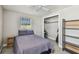 Bedroom featuring a full-sized bed, a window, a closet, and shelving for storage at 150 Bosphorous Ave, Tampa, FL 33606