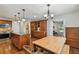 Spacious kitchen with custom wood cabinets, granite counters, stainless appliances, and adjacent dining area at 150 Bosphorous Ave, Tampa, FL 33606
