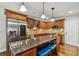 Beautiful kitchen with stainless steel appliances, granite countertops, and a central island with seating at 150 Bosphorous Ave, Tampa, FL 33606