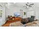 This living room showcases a large TV, hardwood floors, and a comfortable sitting area at 150 Bosphorous Ave, Tampa, FL 33606