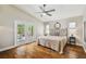 Beautiful main bedroom with hardwood floors, access to the pool, and bright, natural light at 150 Bosphorous Ave, Tampa, FL 33606