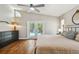 This main bedroom features hardwood floors, sliding glass doors to the pool, and a dresser at 150 Bosphorous Ave, Tampa, FL 33606