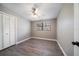 Bedroom with wood flooring, neutral paint, modern lighting, and a large window that provides lots of natural light at 1501 Howard Pl, Largo, FL 33770