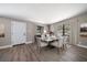 Bright dining room featuring a modern table set, wood floors, and neutral wall color at 1501 Howard Pl, Largo, FL 33770