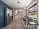 Modern kitchen with blue cabinets, stainless steel appliances, and an adjacent dining area at 1501 Howard Pl, Largo, FL 33770