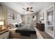 Serene main bedroom with neutral tones, plush bedding, modern decor, and en-suite bathroom at 1501 Howard Pl, Largo, FL 33770