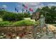View of children bronze statue holding an American flag with several other flags in the background at 1501 Howard Pl, Largo, FL 33770