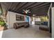 Outdoor patio featuring comfortable seating, fans and a view of the backyard at 1501 Howard Pl, Largo, FL 33770