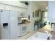 Bright eat-in kitchen features ample cabinets, laminate countertops, and white appliances at 1605 Send Way, Lutz, FL 33549