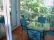 Enjoy outdoor dining on the screened-in lanai with tiled floors and seating for four at 1605 Send Way, Lutz, FL 33549