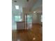 Open living area with hardwood floors, natural light, and sliding glass doors to an outdoor space at 1605 Send Way, Lutz, FL 33549