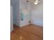 Living room with hardwood floors, large mirror, and ample natural light at 1605 Send Way, Lutz, FL 33549