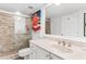 Updated bathroom with a glass-enclosed shower, neutral tile, and a vanity with white cabinets at 17334 Gulf Blvd # 203, North Redington Beach, FL 33708
