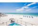 Expansive beach view featuring a swimming pool, lounge chairs, and the Gulf at 17334 Gulf Blvd # 203, North Redington Beach, FL 33708