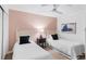 Inviting bedroom with two twin beds, decorative wallpaper, and coastal-themed artwork at 17334 Gulf Blvd # 203, North Redington Beach, FL 33708