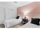 Cozy bedroom with two twin beds, stylish decor, and plenty of natural light at 17334 Gulf Blvd # 203, North Redington Beach, FL 33708