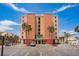 Exterior of a well-maintained Emerald Isle condo building with ample parking at 17334 Gulf Blvd # 203, North Redington Beach, FL 33708