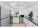 Bright kitchen features modern appliances, stainless steel dishwasher, ample counter space, perfect for meal prep and entertaining at 17334 Gulf Blvd # 203, North Redington Beach, FL 33708