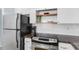 Kitchen features updated appliances, granite countertops, with view to the dining and living room for seamless entertaining at 17334 Gulf Blvd # 203, North Redington Beach, FL 33708