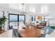 Bright living room with ocean views, a dining table, and coastal-inspired decor at 17334 Gulf Blvd # 203, North Redington Beach, FL 33708