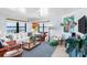 Bright living room with ocean views, a comfortable couch, and coastal decor at 17334 Gulf Blvd # 203, North Redington Beach, FL 33708