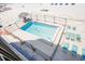 An inviting swimming pool with lounge chairs, and beach view at 17334 Gulf Blvd # 203, North Redington Beach, FL 33708