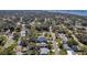 A picturesque aerial shot of a residential community close to the water, featuring established trees and local streets at 1841 Douglas Ave, Dunedin, FL 34698