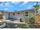 Backyard featuring partial fencing, fire pit, and doorway into the back of the home at 1841 Douglas Ave, Dunedin, FL 34698