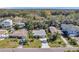 Charming single-story home with a well-maintained lawn and a long driveway leading to the attached garage at 1841 Douglas Ave, Dunedin, FL 34698