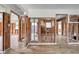 Large open floor plan featuring new floors and an open wall to both the bathroom and kitchen at 1841 Douglas Ave, Dunedin, FL 34698