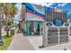 A colorful street view featuring local businesses and artistic murals in a lively neighborhood at 1841 Douglas Ave, Dunedin, FL 34698
