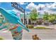 Quirky street view featuring local landmarks and attractions, including a uniquely painted dolphin statue and historic buildings at 1841 Douglas Ave, Dunedin, FL 34698