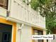 Second story of a house shows an outdoor deck balcony with white railings at 20989 Negril, Lutz, FL 33558