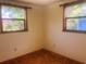 Bright bedroom with two windows, tan carpet, and ample natural light at 20989 Negril, Lutz, FL 33558
