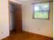 Bedroom with view from window, closet, and electrical outlets at 20989 Negril, Lutz, FL 33558
