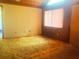 Bright bedroom with wood paneling at 20989 Negril, Lutz, FL 33558