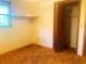This bedroom features tan carpet, a built in closet, and natural light at 20989 Negril, Lutz, FL 33558