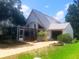 Charming two-story home with a screened porch and well-maintained landscaping at 20989 Negril, Lutz, FL 33558