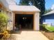 Open garage providing ample parking and storage at 20989 Negril, Lutz, FL 33558