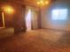Spacious living room with paneled walls, sliding glass door and window at 20989 Negril, Lutz, FL 33558