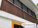 Exterior view of a screened-in, second-story balcony providing a private outdoor space at 20989 Negril, Lutz, FL 33558