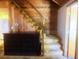 Carpeted staircase with wooden paneling and a built-in cabinet at 20989 Negril, Lutz, FL 33558