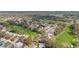 Aerial view of houses in a golf community surrounded by trees at 2222 Westchester Blvd, Spring Hill, FL 34606