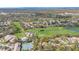Aerial view of the neighborhood, golf course, and water feature at 2222 Westchester Blvd, Spring Hill, FL 34606