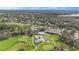 Aerial view showcasing the golf course, pool, and community amenities at 2222 Westchester Blvd, Spring Hill, FL 34606